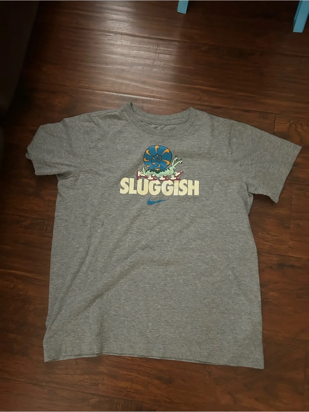 Nike Kids Gray Tee with Colorful 'Sluggish' Character Graphic
